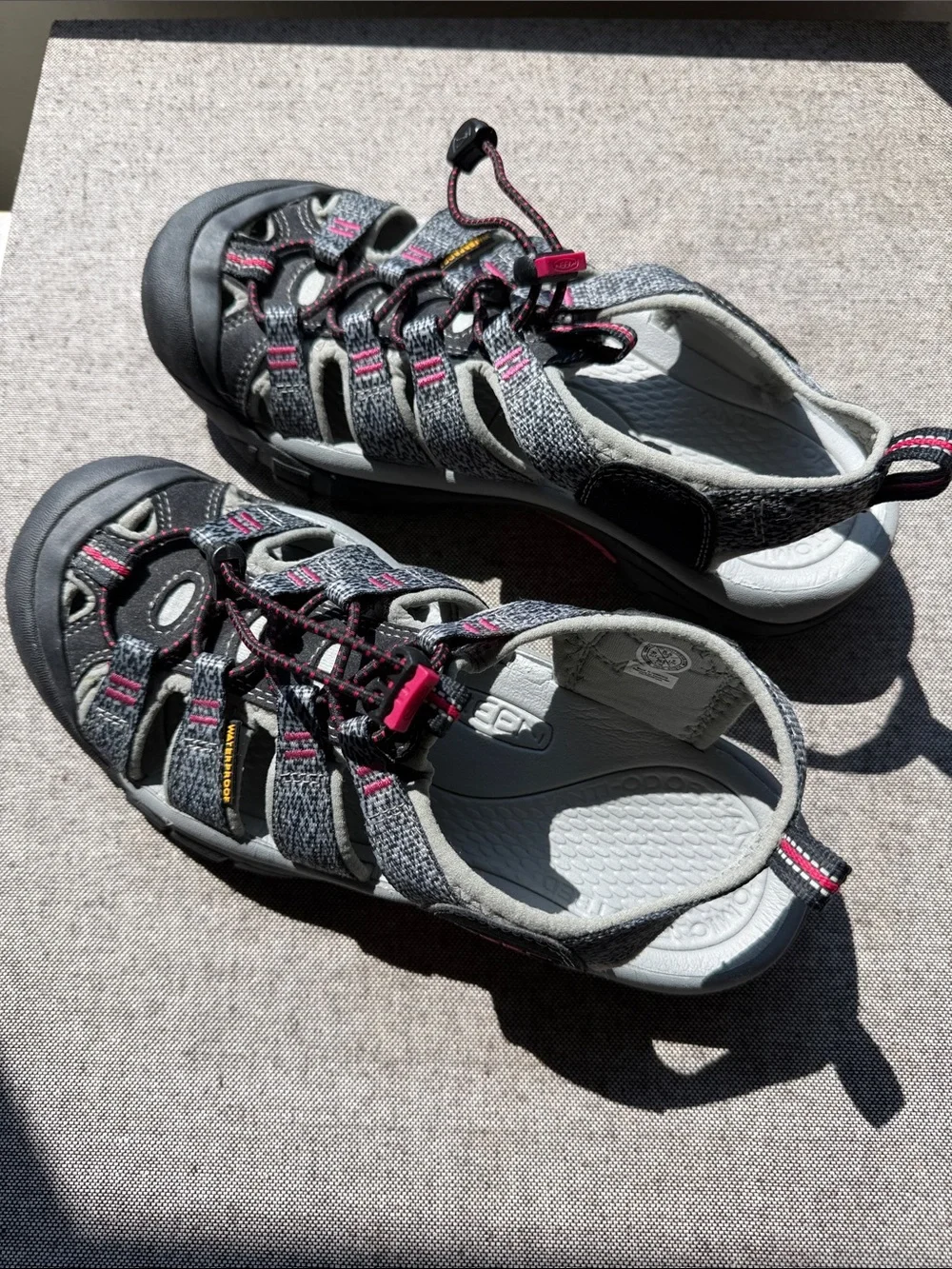 Keen Women’s waterproof Sandals. Gray with pink accents. Rugged soles for hiking